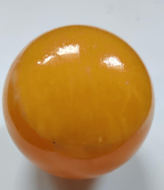 Leuchtende brasilianische orangefarbene Calcitkugel – 68 mm